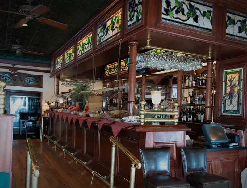 The Chances R bar: carved mahogany, stained-glass panels, brass rail and leather stools